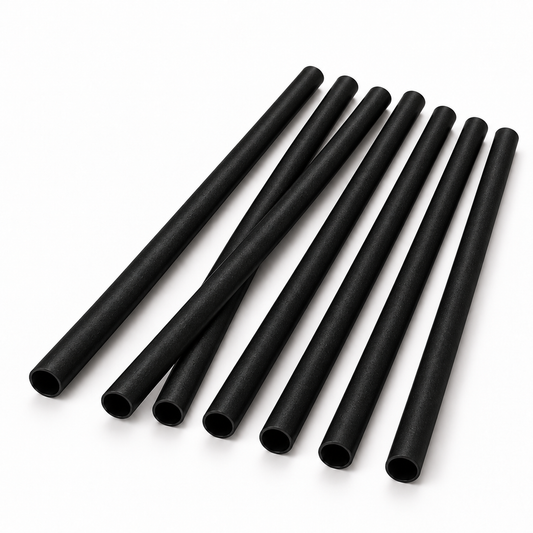 Short matte black agave cocktail straws with subtle fiber texture on a white background